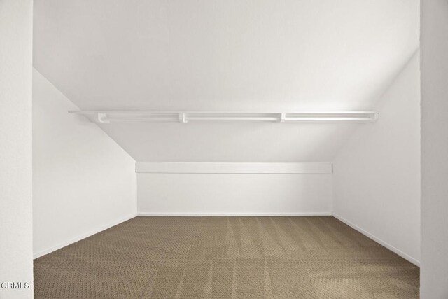 477 S Euclid Ave Unit A, Pasadena, CA 91101 - walk in closet featuring vaulted ceiling and carpet floors