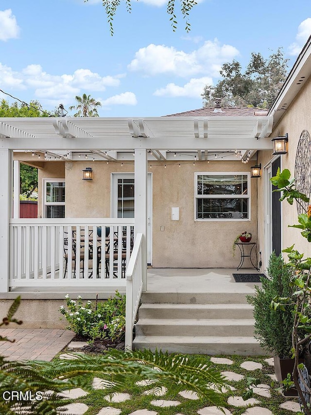 2250 Cooley Pl, Pasadena, CA 91104 - entrance to property with stucco siding, a pergola, and covered porch