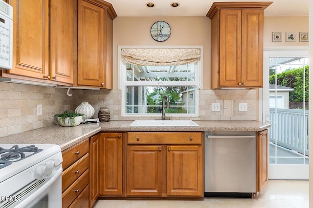 2250 Cooley Pl, Pasadena, CA 91104 - kitchen featuring dishwasher, brown cabinets, and backsplash