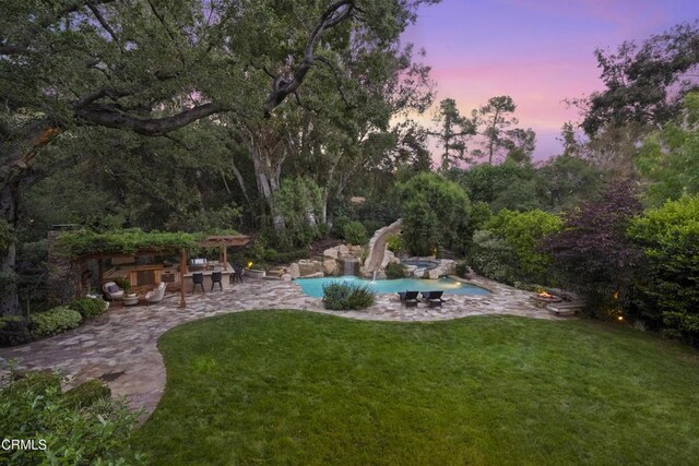 1550 Scenic Dr, Pasadena, CA 91103 - yard at dusk featuring a yard, a patio, and an outdoor pool