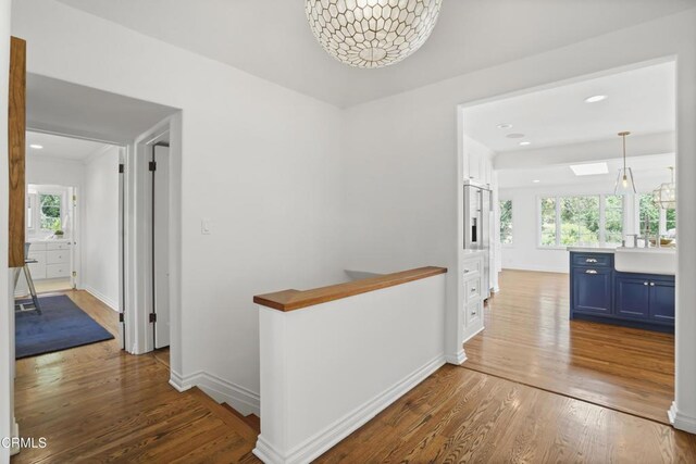 1550 Scenic Dr, Pasadena, CA 91103 - hall featuring an upstairs landing, wood finished floors, and recessed lighting