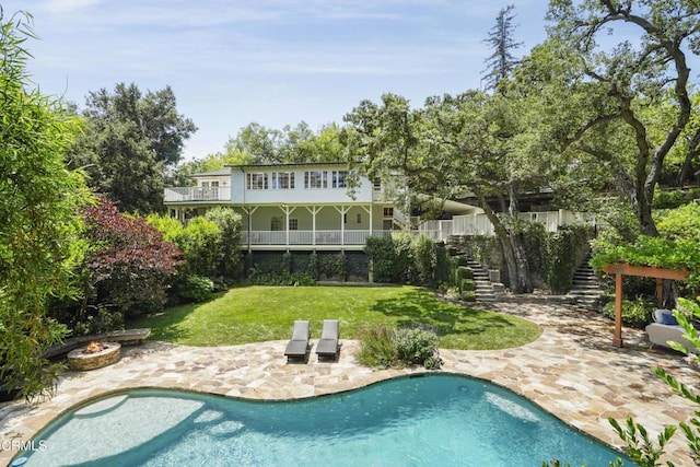 1550 Scenic Dr, Pasadena, CA 91103 - rear view of house featuring stairs, a yard, a fire pit, a patio, and an outdoor pool