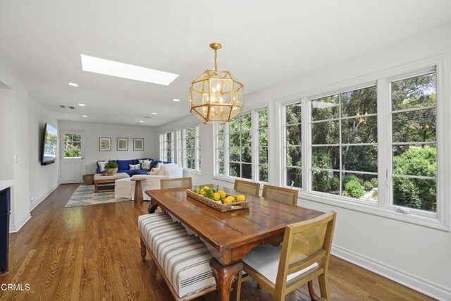 1550 Scenic Dr, Pasadena, CA 91103 - dining room with healthy amount of natural light, a chandelier, a skylight, dark wood-type flooring, and recessed lighting