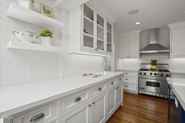 1550 Scenic Dr, Pasadena, CA 91103 - kitchen with wall chimney exhaust hood, luxury range, open shelves, backsplash, and white cabinetry