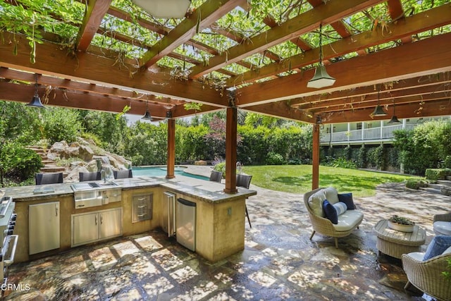 1550 Scenic Dr, Pasadena, CA 91103 - view of patio with area for grilling and a pergola