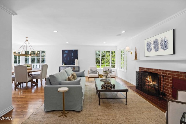 1550 Scenic Dr, Pasadena, CA 91103 - living room with wood finished floors, a brick fireplace, a chandelier, recessed lighting, and crown molding