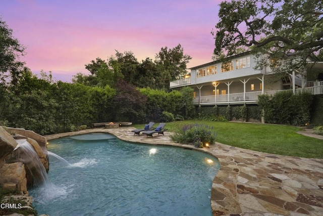 1550 Scenic Dr, Pasadena, CA 91103 - pool at dusk featuring a patio area, a yard, and an outdoor pool