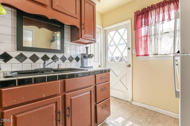 15207 Lorne St, Panorama City, CA 91402 - kitchen featuring tile countertops, light tile patterned flooring, and tasteful backsplash