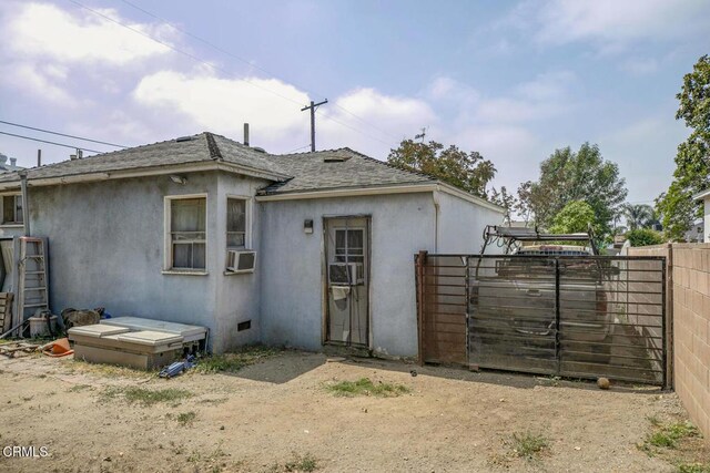 15207 Lorne St, Panorama City, CA 91402 - rear view of property with a shingled roof, stucco siding, and cooling unit