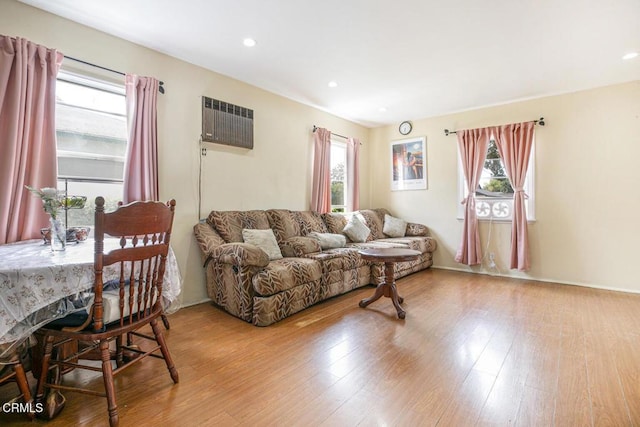 15207 Lorne St, Panorama City, CA 91402 - living room with plenty of natural light, a wall unit AC, wood finished floors, and recessed lighting