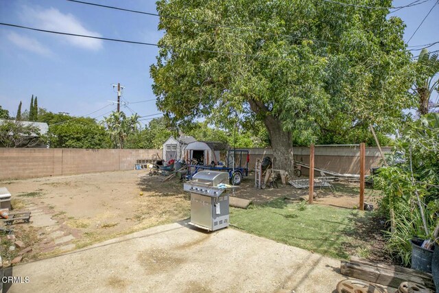 15207 Lorne St, Panorama City, CA 91402 - fenced backyard with a patio and a shed