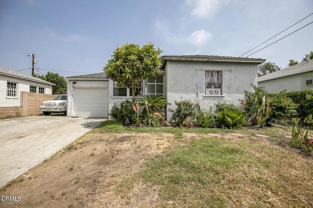 15207 Lorne St, Panorama City, CA 91402 - view of front of house featuring a garage, stucco siding, and concrete driveway