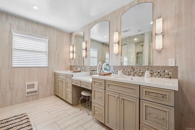 525 Hilo Way, Vista, CA 92081 - bathroom featuring heating unit, vanity, backsplash, and a shower stall