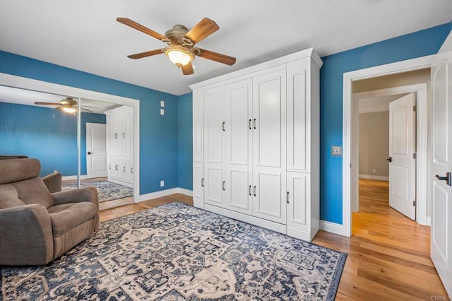 525 Hilo Way, Vista, CA 92081 - living area with a ceiling fan and light wood-style flooring