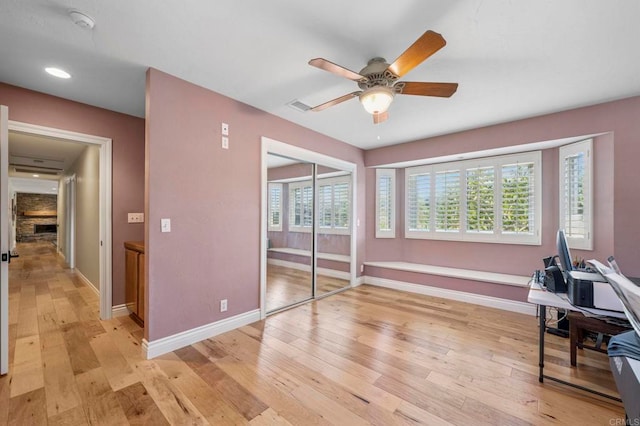 525 Hilo Way, Vista, CA 92081 - interior space featuring ceiling fan, light wood finished floors, and a stone fireplace