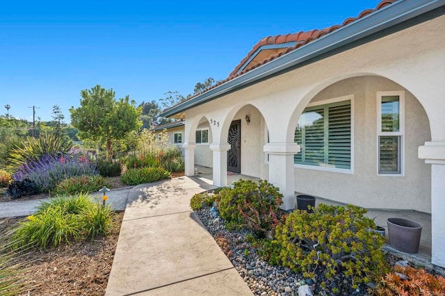 525 Hilo Way, Vista, CA 92081 - view of exterior entry featuring stucco siding and a tiled roof