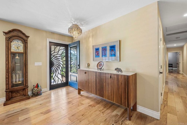 525 Hilo Way, Vista, CA 92081 - foyer entrance with light wood-type flooring and a chandelier