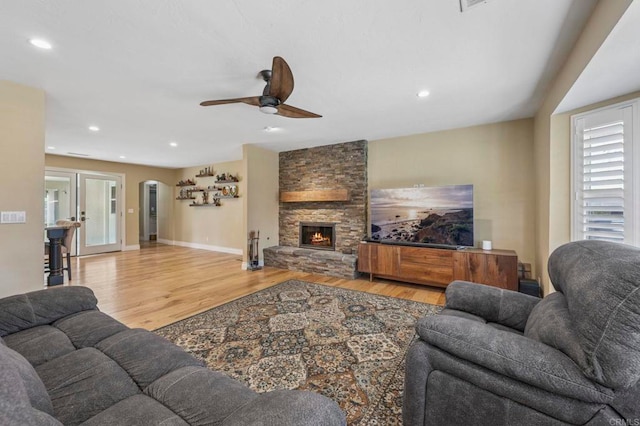 525 Hilo Way, Vista, CA 92081 - living area with light wood finished floors, ceiling fan, a fireplace, and recessed lighting