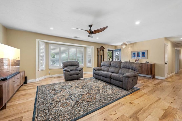 525 Hilo Way, Vista, CA 92081 - living room with light wood finished floors, a ceiling fan, and recessed lighting