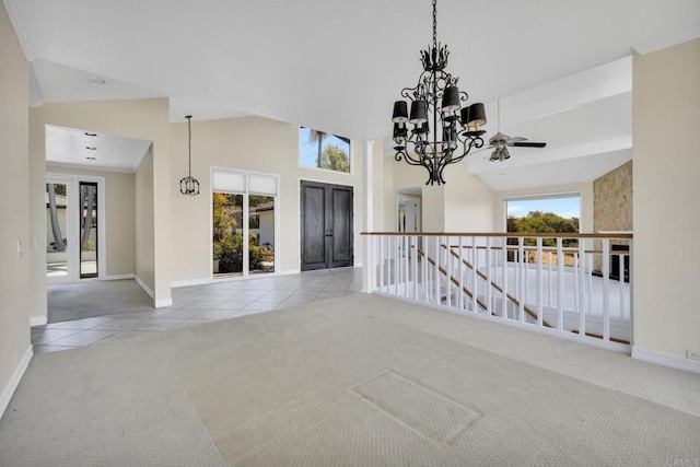 1138 Via Mil Cumbres, Solana Beach, CA 92075 - carpeted entrance foyer featuring tile patterned flooring, a chandelier, a high ceiling, and a ceiling fan