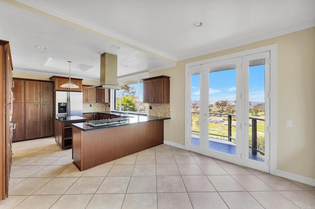 1138 Via Mil Cumbres, Solana Beach, CA 92075 - kitchen featuring island range hood, appliances with stainless steel finishes, a peninsula, backsplash, and crown molding