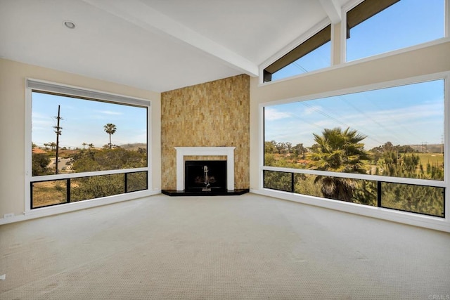 1138 Via Mil Cumbres, Solana Beach, CA 92075 - unfurnished living room with beamed ceiling, carpet flooring, and a fireplace with raised hearth