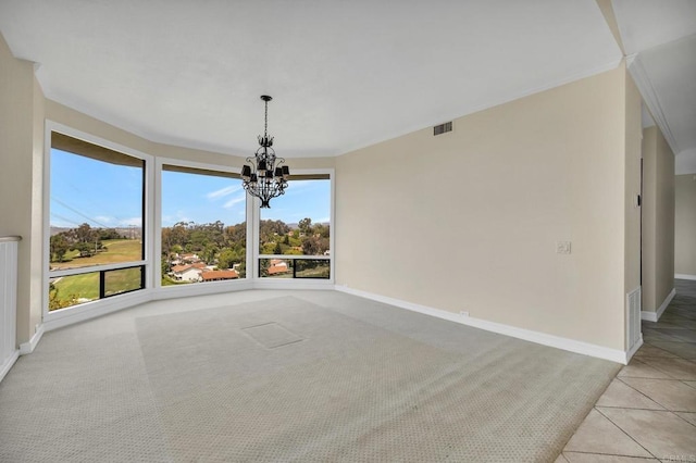 1138 Via Mil Cumbres, Solana Beach, CA 92075 - spare room with a chandelier, plenty of natural light, light carpet, crown molding, and light tile patterned floors