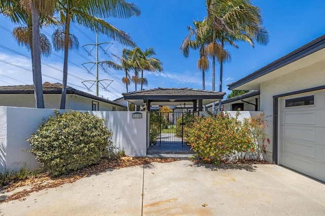 1138 Via Mil Cumbres, Solana Beach, CA 92075 - view of parking with a gate and an attached garage