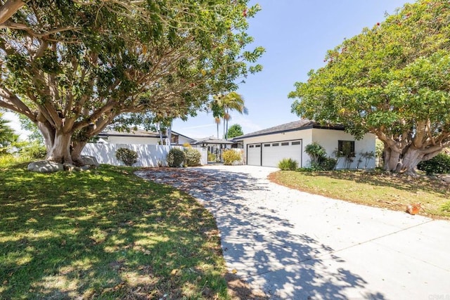 1138 Via Mil Cumbres, Solana Beach, CA 92075 - view of front of property with concrete driveway, an attached garage, and stucco siding