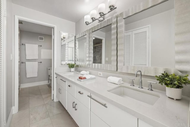 2500 Torrey Pines Rd Unit 1202, La Jolla, CA 92037 - full bathroom with double vanity, marble look tile flooring, and a closet