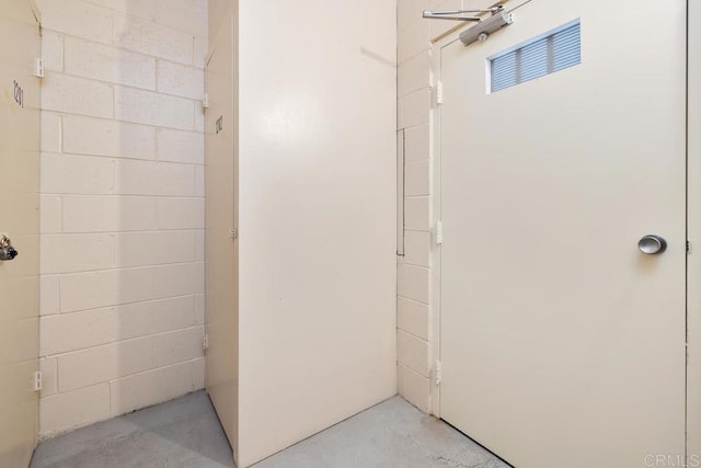 2500 Torrey Pines Rd Unit 1202, La Jolla, CA 92037 - bathroom with concrete flooring and concrete block wall
