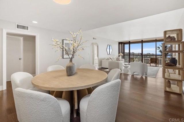 2500 Torrey Pines Rd Unit 1202, La Jolla, CA 92037 - dining room featuring arched walkways, wood finished floors, and recessed lighting
