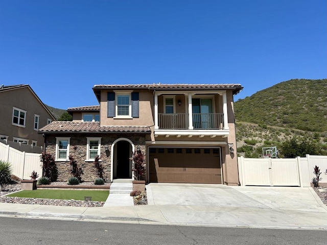 35909 Shetland Hls E, Fallbrook, CA 92028 - mediterranean / spanish home featuring a tile roof, concrete driveway, an attached garage, and stucco siding