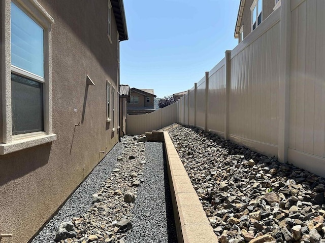 35909 Shetland Hls E, Fallbrook, CA 92028 - view of side of property featuring stucco siding and a fenced backyard
