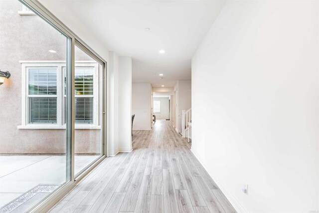 35909 Shetland Hls E, Fallbrook, CA 92028 - hall with light wood-style flooring, recessed lighting, and an upstairs landing