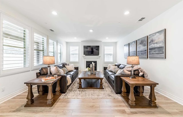 35909 Shetland Hls E, Fallbrook, CA 92028 - living area with light wood-style floors, a glass covered fireplace, and recessed lighting