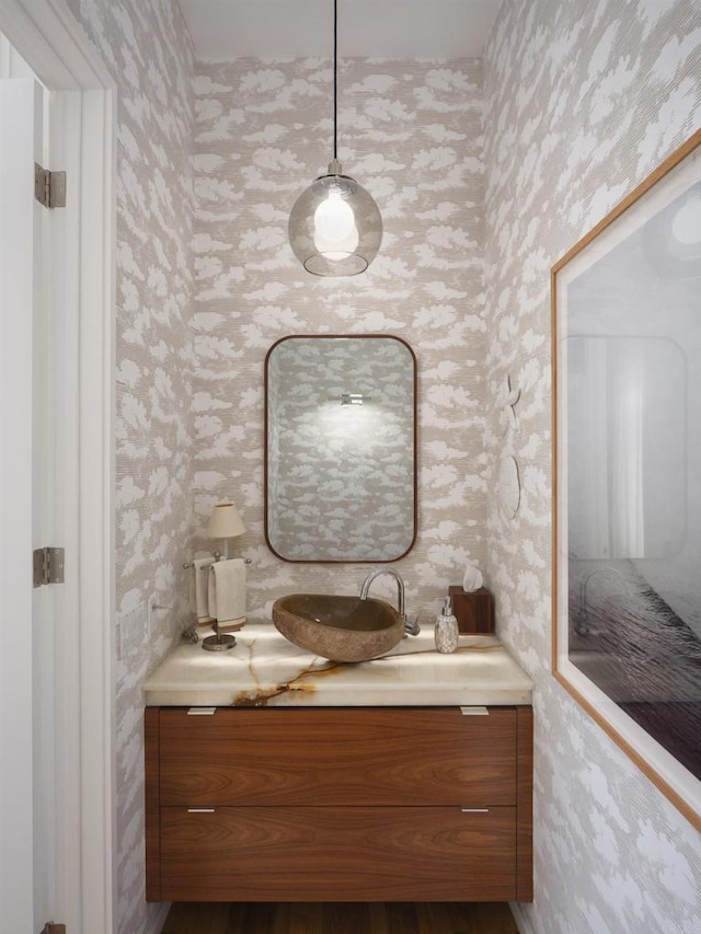 265 Coast Blvd Unit 9, La Jolla, CA 92037 - bathroom with wallpapered walls and vanity