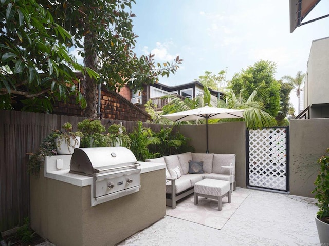 265 Coast Blvd Unit 9, La Jolla, CA 92037 - fenced backyard with area for grilling, a patio, and an outdoor living space