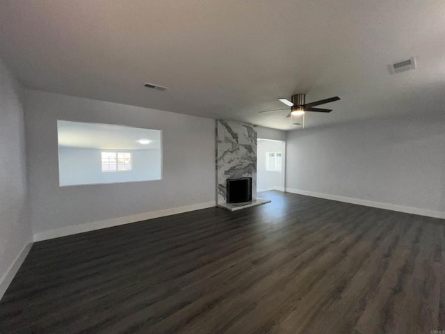 633 Kempton, Spring Valley, CA 91977 - unfurnished living room with dark wood-type flooring, ceiling fan, and a premium fireplace