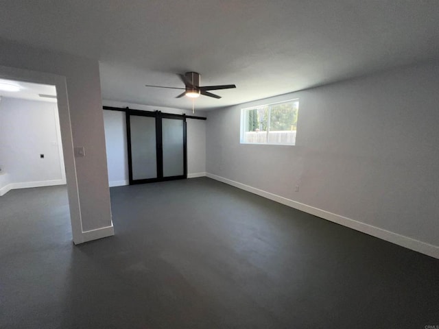 633 Kempton, Spring Valley, CA 91977 - unfurnished bedroom featuring a barn door, a ceiling fan, and concrete flooring