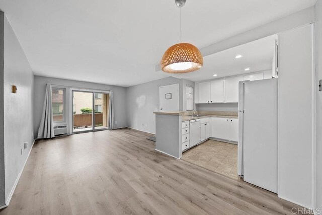 5910 Rancho Mission Rd Unit 37, San Diego, CA 92108 - kitchen featuring white appliances, light countertops, white cabinetry, light wood-type flooring, and recessed lighting