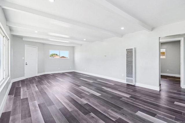 1947 D Ave, National City, CA 91950 - unfurnished living room featuring a heating unit, beam ceiling, dark wood finished floors, and recessed lighting