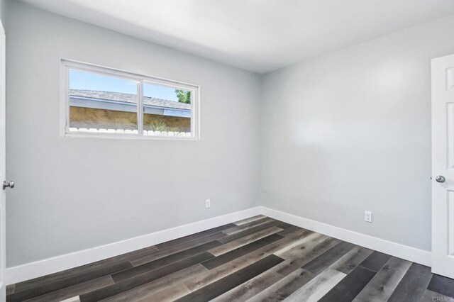1947 D Ave, National City, CA 91950 - spare room featuring baseboards and dark wood finished floors