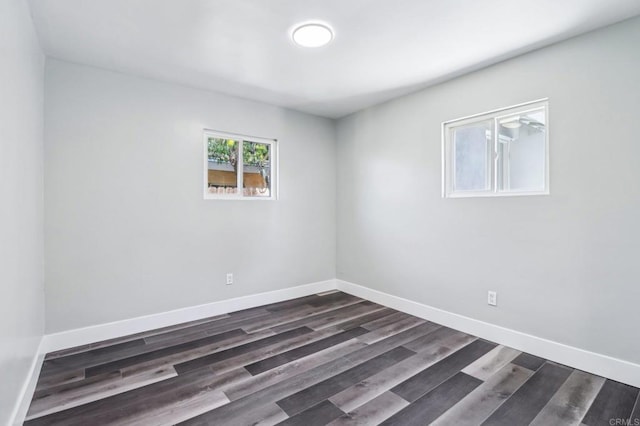 1947 D Ave, National City, CA 91950 - unfurnished room featuring baseboards and dark wood-style floors
