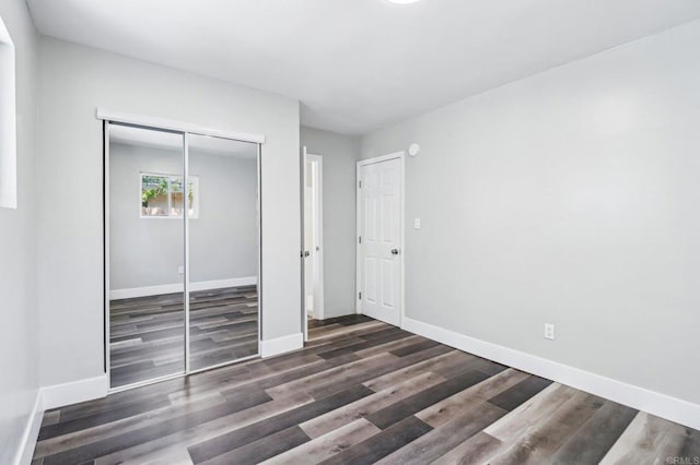 1947 D Ave, National City, CA 91950 - unfurnished bedroom with wood finished floors and a closet