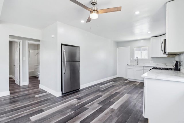 1947 D Ave, National City, CA 91950 - kitchen featuring appliances with stainless steel finishes, a ceiling fan, dark wood-type flooring, white cabinetry, and recessed lighting