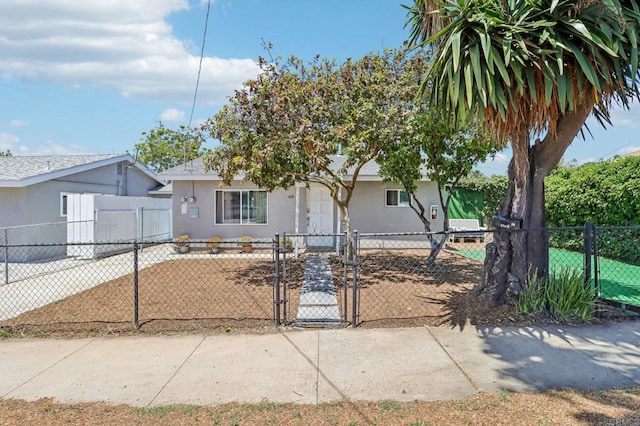 1947 D Ave, National City, CA 91950 - view of front facade with stucco siding, a gate, and a fenced front yard