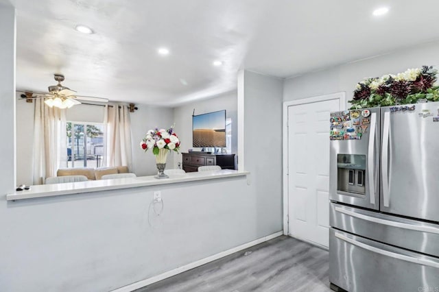 1947 D Ave, National City, CA 91950 - kitchen with stainless steel refrigerator with ice dispenser, wood finished floors, recessed lighting, and ceiling fan