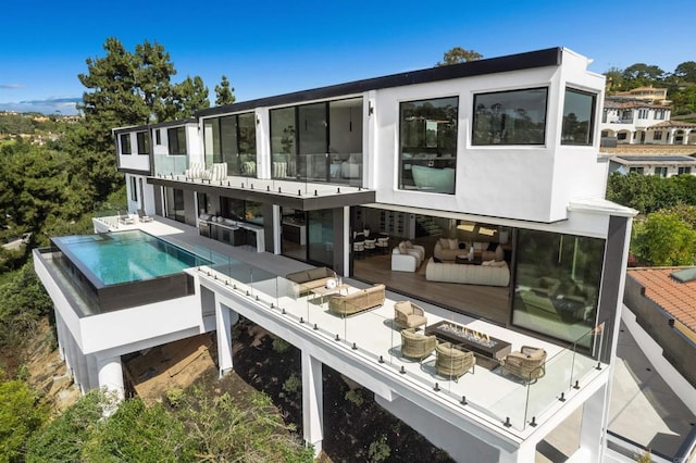 6627 Muirlands Dr, La Jolla, CA 92037 - rear view of house featuring an outdoor hangout area, an outdoor pool, a balcony, and a patio