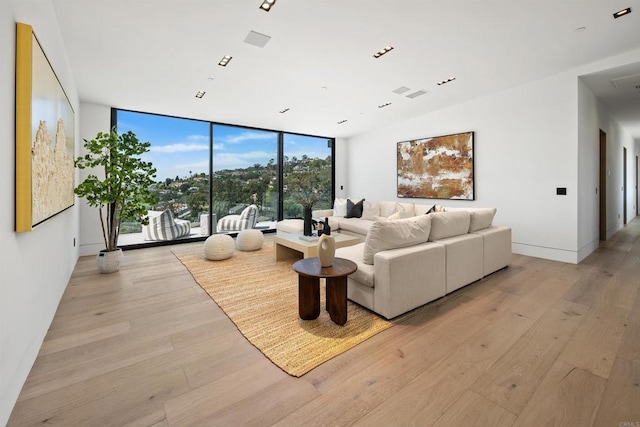 6627 Muirlands Dr, La Jolla, CA 92037 - living area featuring a wall of windows and light wood-style floors